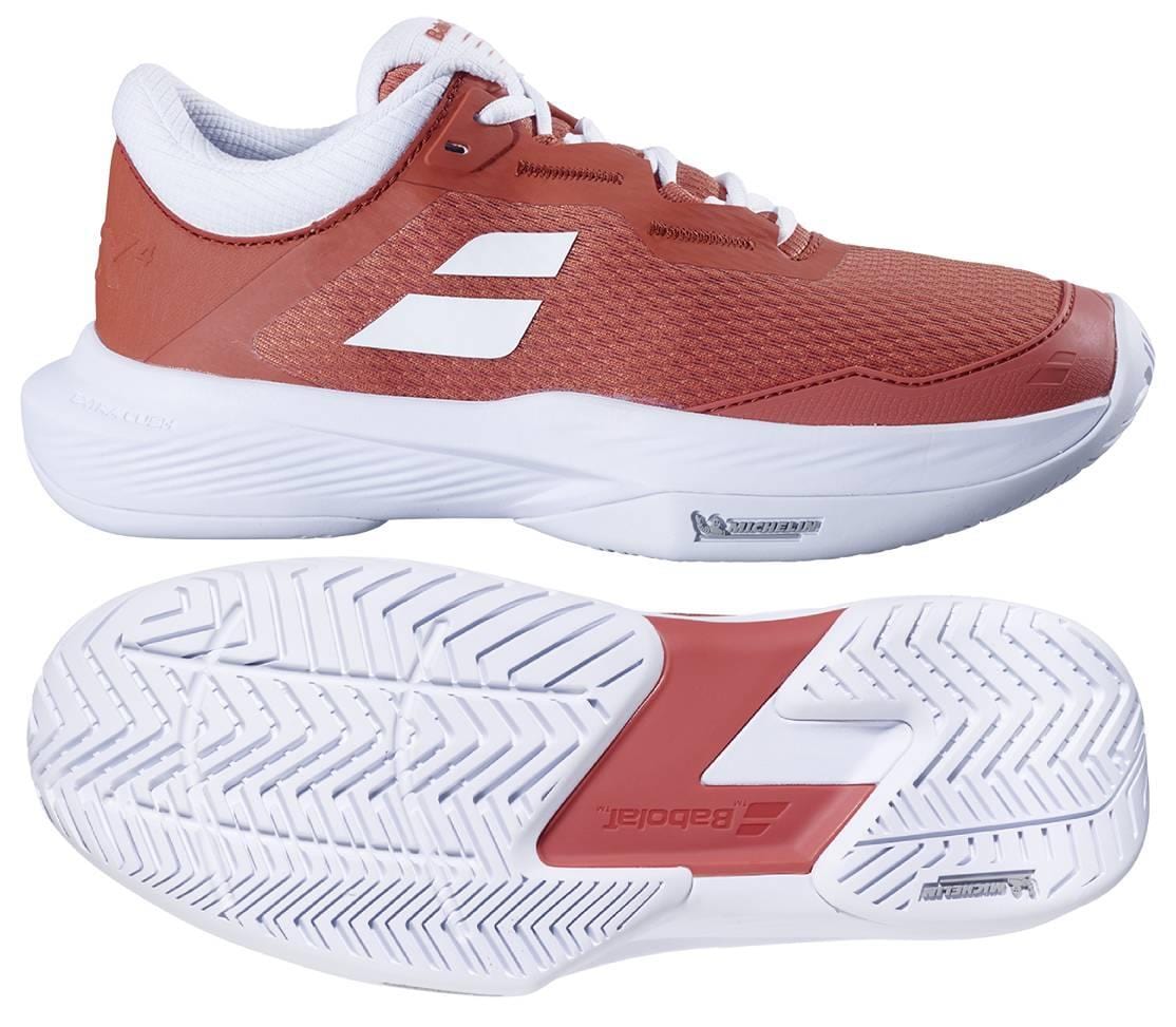 The Babolat SFX 4 Womens Tennis Shoes in Terra Cotta are shown from the side and bottom, featuring a textured white sole, white laces, and logo details—blending style and comfort for on-court performance.