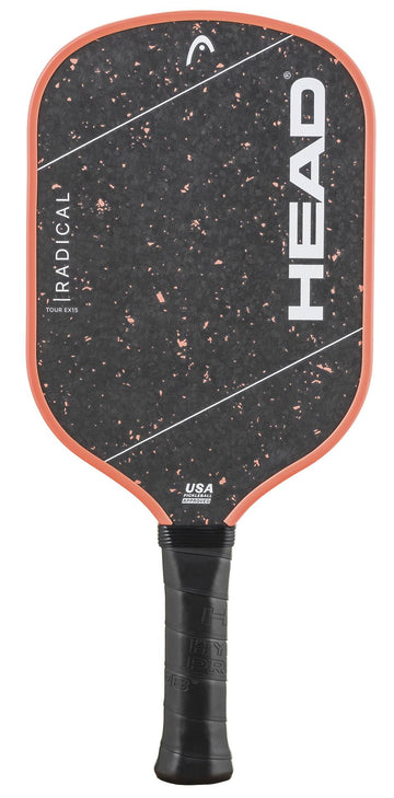 The HEAD Radical Tour EX15 2026 Pickleball Paddle features a black design with orange trim, prominent white HEAD branding, and a textured speckled surface. Its black handle is wrapped for a secure grip, and the paddle’s thermoformed construction offers enhanced durability and high-level performance on the court.