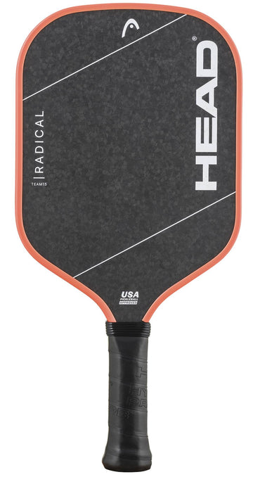 A HEAD Radical Team 15 2026 Pickleball Paddle in black, featuring an orange-red edge, white diagonal lines, and prominent HEAD branding on the face. The paddle is equipped with a TriFlex core for superior performance and has a handle wrapped in black grip tape.