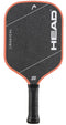 A HEAD Radical Team 15 2026 Pickleball Paddle in black, featuring an orange-red edge, white diagonal lines, and prominent HEAD branding on the face. The paddle is equipped with a TriFlex core for superior performance and has a handle wrapped in black grip tape.