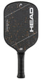 The HEAD Radical Pro EX15 2026 Pickleball Paddle by HEAD features a black and orange speckled face accented with white diagonal lines and the large, bold "HEAD" logo in white. Its raw carbon surface is designed to enhance spin and control, while the handle is wrapped in black grip tape for added comfort.