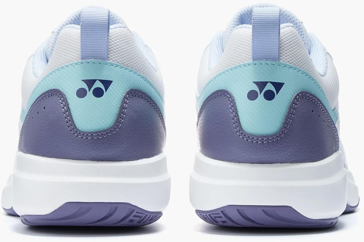 Back view of two Yonex Pro-Move Classic Mens Tennis Shoes in white/sax by Yonex, featuring light blue, teal, and white accents with a dark blue heel logo and Power Cushion technology for superior on-court comfort.