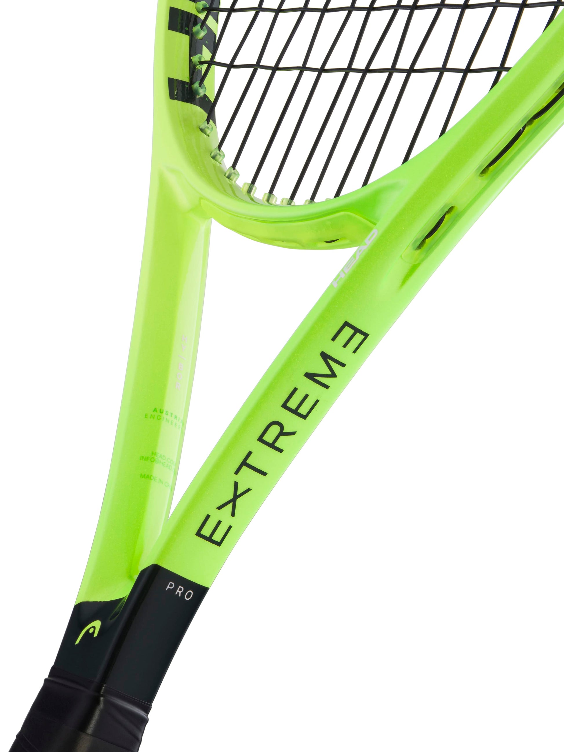 A close-up view of the HEAD Extreme Pro 2026 Tennis Racket, a control-oriented model in neon yellow-green with black strings and "EXTREME" displayed on the frame. The handle, partially shown, features "PRO," emphasizing its heavy spin capabilities.
