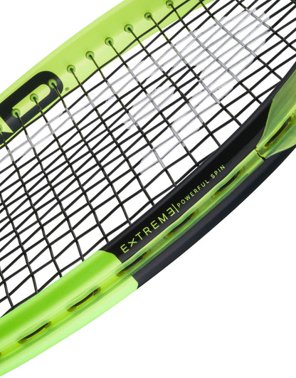 A close-up of the HEAD Extreme MP 2026 Tennis Racket showcases its vibrant yellow and black design, with “EXTREME POWERFUL SPIN” printed on the frame near the strings, emphasizing its outstanding spin and power.