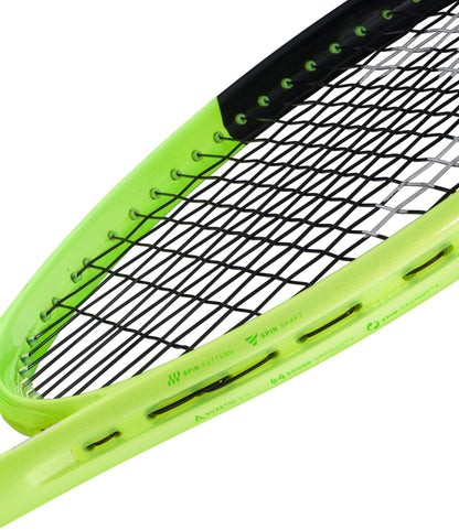 A detailed close-up of the HEAD Extreme MP 2026 Tennis Racket by HEAD showcases its vibrant neon yellow-green frame paired with black strings. The frame displays small printed icons and text, highlighting design elements such as the precise string pattern and grommet holes engineered to deliver enhanced power and spin.