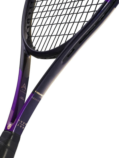 Close-up of the HEAD Gravity Tour Zverev 2026 Tennis Racket, a limited edition from HEAD in bold purple and black hues, showcasing prominent strings and brand logos on the frame against a white background—a design inspired by Alexander Zverev.