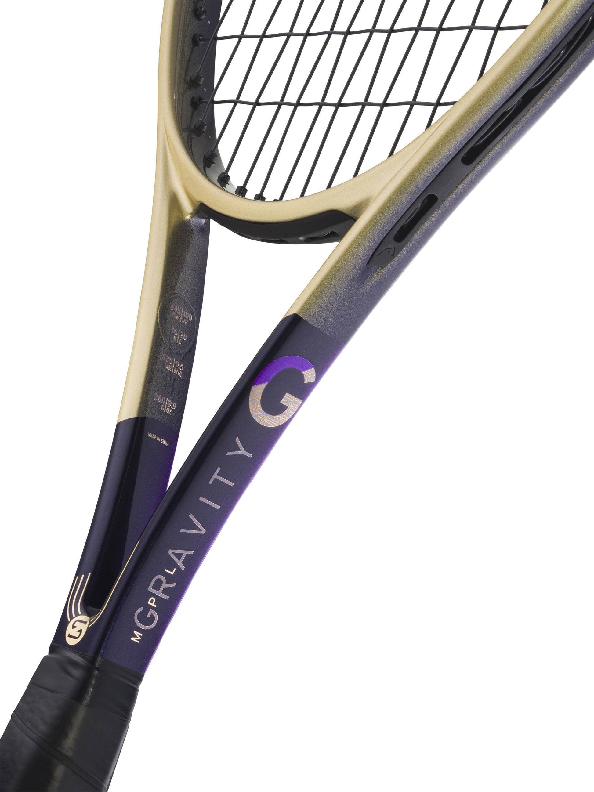 Close-up of two tennis rackets overlapping, highlighting the HEAD Gravity MP L Zverev 2026 Tennis Racket—a limited edition model from HEAD—featuring a striking gradient gold and purple frame, black strings, and advanced Auxetic 2.0 technology.