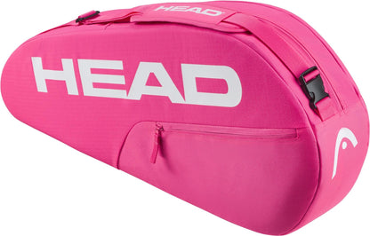 The HEAD Base 3 Racket Tennis Bag S in bright pink features a white HEAD logo, top handle, adjustable shoulder strap, and a zippered side pocket.