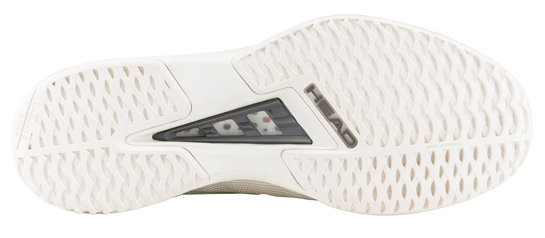 The HEAD Sprint Pro 4.0 Mens Tennis Shoes in Chalk White/Dark Grey feature a white sole with textured grip, a central transparent panel, geometric traction grooves, and the "HEAD" logo near the arch—ideal for lightweight tennis performance.