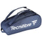 The Navy Blue Tecnifibre Tour Endurance 2023 9 Racket Tennis Bag displays a white logo. Made with robust tarpaulin fabric, it offers several compartments and includes a comfortable shoulder strap for easy carrying.