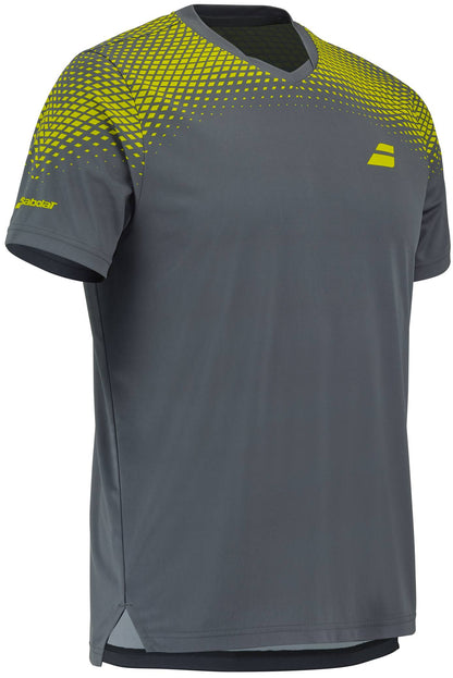 The Babolat Aero Crew Neck Men's Tennis T-Shirt in Grey/Aero features yellow geometric patterns on the shoulders and chest, a small yellow logo on the left chest, and an additional logo on the left sleeve. Designed with a crew neck and relaxed fit, this Babolat shirt is made for quick-dry performance, making it an excellent option for men's tennis apparel.