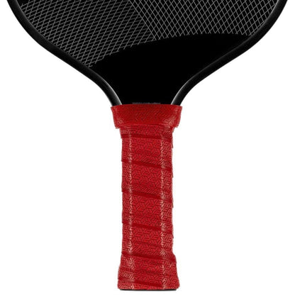 Close-up of the handle and lower part of a black paddle featuring the Lizard Skin DSP Ultra Pickleball Grip 0.8mm in Crimson Red, providing a non-slip, geometric grip for enhanced control in pickleball or paddle tennis.