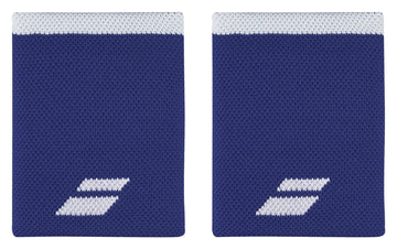 Two Babolat Jumbo Logo Wristbands in white and sodalite blue showcase a comfortable knit texture, featuring a subtle white logo in the bottom corner and a distinct white stripe along the top edge. They are presented side by side against a clean white background.