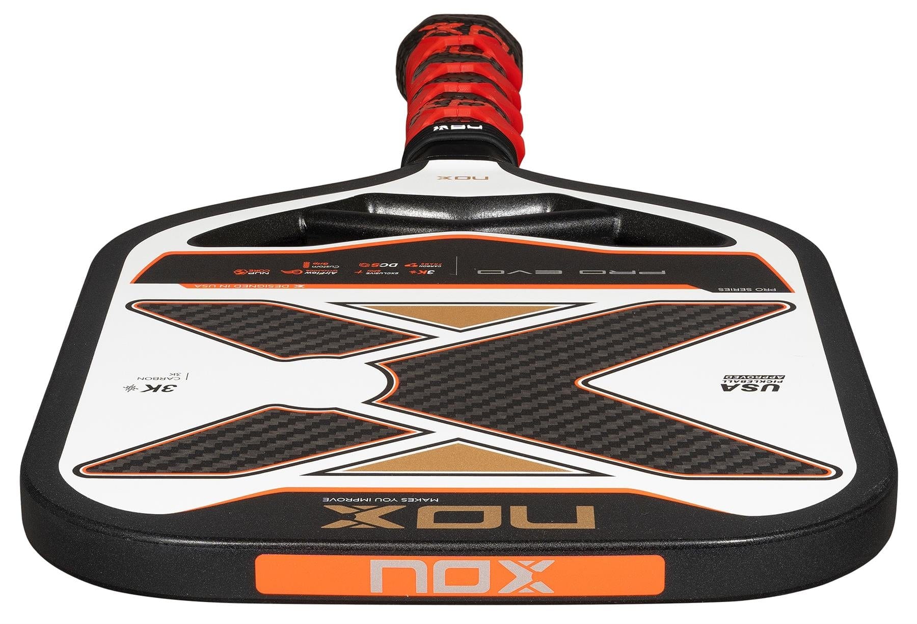 A close-up of the NOX Pro Evo Pickleball Paddle by NOX in black and red, highlighting its large X design on the 3K carbon fiber face and a matching wrapped handle.