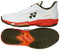 The Yonex Power Cushion Ad-Accel Men's Tennis Shoes in white and orange feature a herringbone-patterned sole for speed on court, orange accents, and "A3-ACCEL" branding shown from the side and bottom.