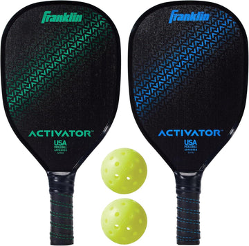 The Franklin Activator 2-Player Pickleball Set by Franklin is shown with two black, USA Pickleball Approved paddles—one with green and one with blue accents—displayed above two yellow perforated pickleballs.