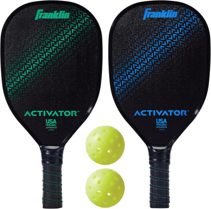 The Franklin Activator 2-Player Pickleball Set by Franklin is shown with two black, USA Pickleball Approved paddles—one with green and one with blue accents—displayed above two yellow perforated pickleballs.