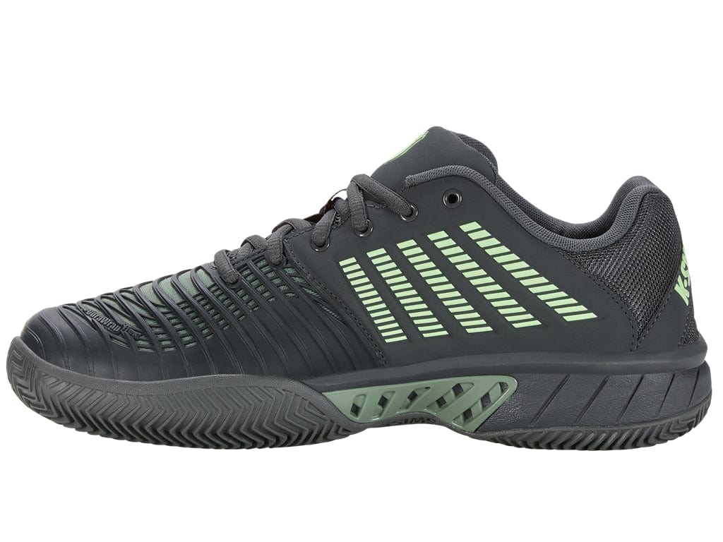 Introducing the K-Swiss Express Light 3 HB Men's Tennis Shoes – Sea Spray / Urban Chic / Soft Neon Green. These shoes feature a dark gray base with stylish green accents on the side and heel, crafted for excellent on-court performance. Equipped with a textured sole designed for clay court traction and complemented by black laces, the shoe's design is finished with angled lines and logos for a sleek, fashionable look.