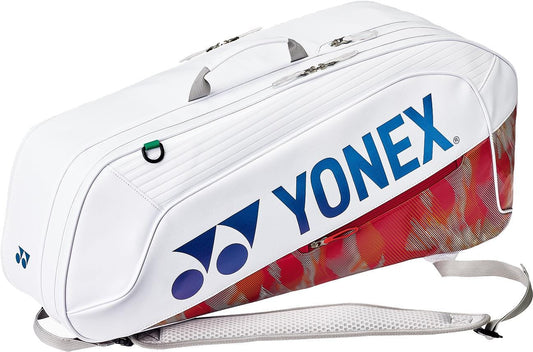 The Yonex 02626EX Expert 6 Racket Tennis Bag in white features a blue logo, red-gold end pattern, shoulder strap, carry handles, zippers, and thermoguard protection for rackets.