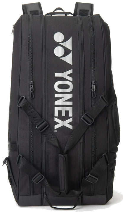 The Yonex BA72629EX Gearlogic 9 Racket Tennis Bag in black features multiple zippered compartments, padded shoulder straps, and a vertical white Yonex logo and text on the front.