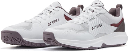 The Yonex Pro-Move Classic WIDE Men's Tennis Shoes in white and red, featuring lace-up design, Power Cushion technology, and textured rubber soles, are displayed against a white background.