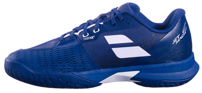 The Babolat Jet Mach 4 All Court Men's Tennis Shoe in dark blue with white accents, featuring a textured outsole and branding on the side and heel, is shown from the left against a white background.