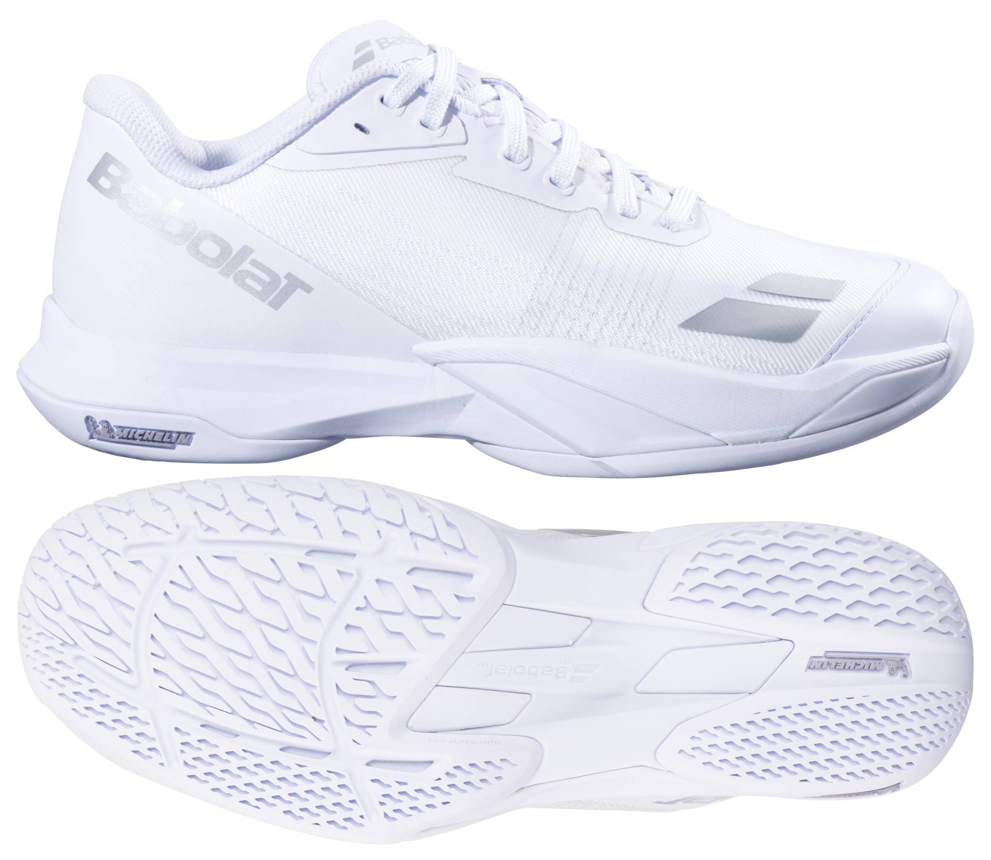 The Babolat Jet Mach 4 All Court Women's Tennis Shoes in white and silver are shown from the side and bottom, highlighting sleek design, textured soles for agility, and signature silver Babolat branding on the side and tongue.