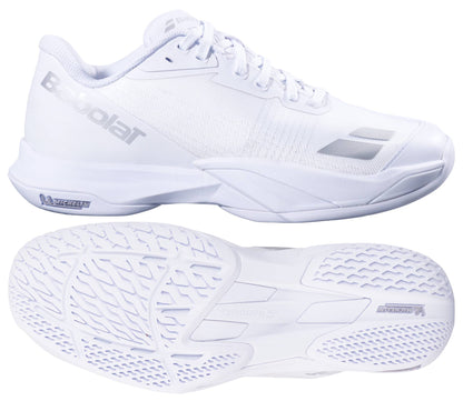 The Babolat Jet Mach 4 All Court Women's Tennis Shoes in white and silver are shown from the side and bottom, highlighting sleek design, textured soles for agility, and signature silver Babolat branding on the side and tongue.