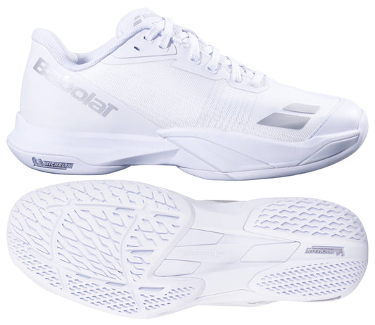 The Babolat Jet Mach 4 All Court Women's Tennis Shoes in white and silver are shown from the side and bottom, highlighting sleek design, textured soles for agility, and signature silver Babolat branding on the side and tongue.