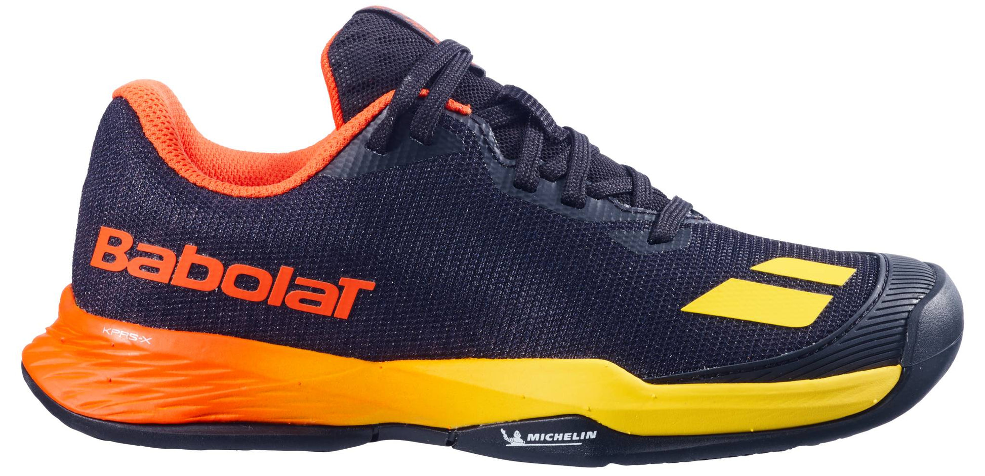 The Babolat Jet Mach 3 Junior All Court Boys Tennis Shoes in Black/Sunset feature orange and yellow accents, an orange inner lining, “Babolat” branding on the side, and a lightweight design with a Michelin-logo sole.
