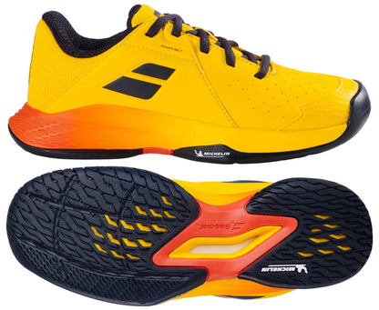 The Babolat Propulse Junior 3 All Court Boys Tennis Shoes in Yellow/Sunset, shown from side and bottom views, feature black accents, black soles, and a Michelin outsole with textured grip.