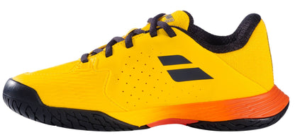 The Babolat Propulse Junior 3 All Court Boys Tennis Shoes in Yellow/Sunset offer a sporty look with black details and orange accents, plus a Michelin outsole for great grip—ideal for junior tennis players.