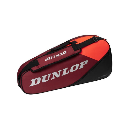 The Dunlop CX Performance 3 Tennis Racket Bag in black and red features a bold design with an orange accent. It is expertly crafted to fit your tennis rackets perfectly, offering an accessory pocket and adjustable shoulder strap, with the "Dunlop" brand name prominently displayed in white letters.