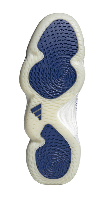 The image displays the sole of adidas Stabil 16 Men's Indoor Court Shoes in white and blue, showcasing a textured design with blue and translucent sections, circular patterns, and the logo at center. The BOOST midsole ensures improved grip and comfort, offering a sustainable option for athletes.