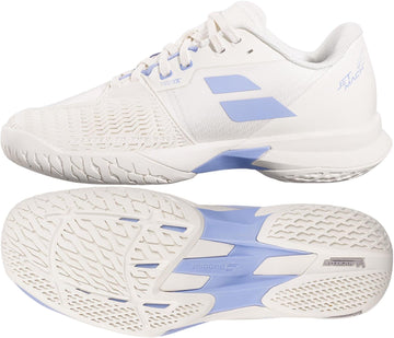 A pair of Babolat Jet Mach 4 All Court Women's Tennis Shoes in lavender and white, shown from the side and bottom to highlight the textured sole pattern and brand logo, designed for agility on the court.