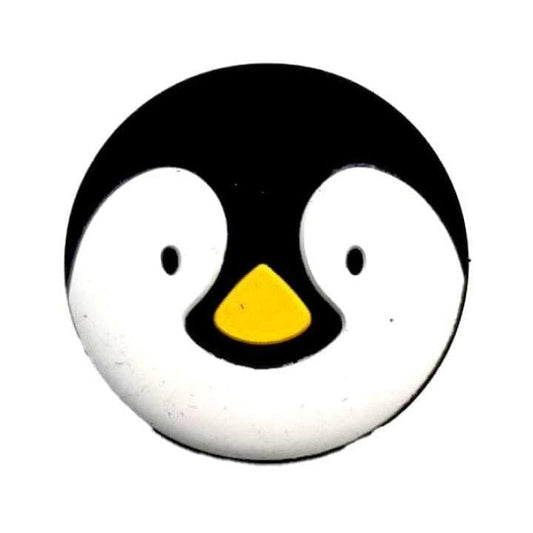 The Babolat Loony Damp Tennis Dampener - Penguin by Babolat features a playful, round cartoon penguin face with a black head, white face, small black eyes, and a yellow beak on a white background.