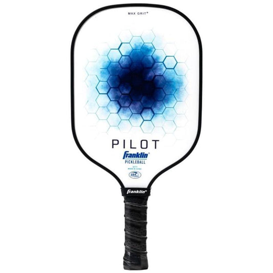 The Franklin Pilot Pickleball Paddle in white and blue features a black handle, blue hexagon pattern, visible Franklin branding and logo, "PILOT" text on the face, and is USA Pickleball approved for quality play.