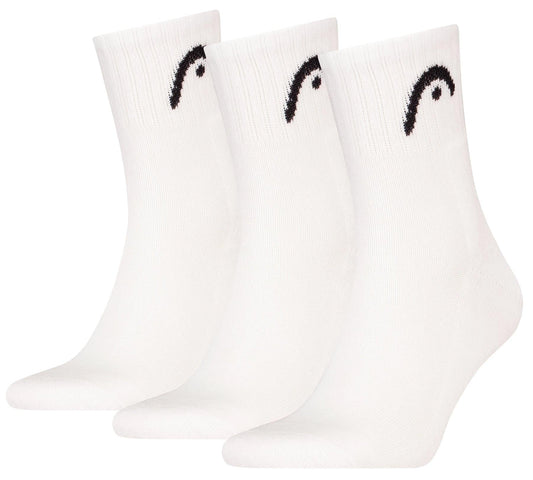 Three pairs of HEAD Club Short Crew Tennis Socks - White (3 Pack) are displayed upright, each featuring a small black HEAD logo near the top and cushioned soles for added comfort.
