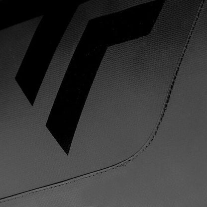 A close-up of a textured surface showcases two prominent, black, angled stripes against a dark gray backdrop. This minimalist design echoes the sleek style found on the Tecnifibre Tour Endurance 2024 12 Racket Tennis Bag - Ultra Black, emphasizing the detailed stitching along the fabric's edges.