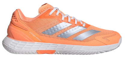 The ADIDAS Defiant Speed 2 Women’s Tennis Shoes in orange feature white laces, a white sole, and three silver stripes, with “DEFIANT SPEED” printed near the heel—ideal lightweight shoes from adidas for quick play.