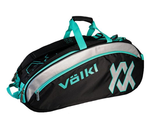 The Volkl Combi 6 Racket Tennis Bag in Black and Turquoise is a roomy choice with several compartments, showcasing the Volkl logo on the side. It features turquoise handles and zipper accents, along with silver stripe detailing and a thermal climate-controlled lining to safeguard your gear.