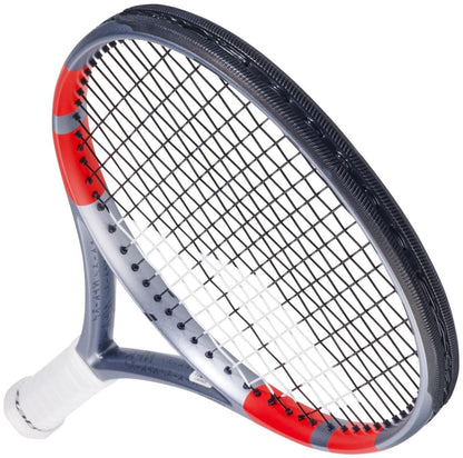 A close-up of the Babolat Pure Strike 100 Gen4 Tennis Racket in Carbon Grey, featuring red accents, black strings, and a white grip—engineered by Babolat with advanced technologies for peak performance, displayed angled on a white background.
