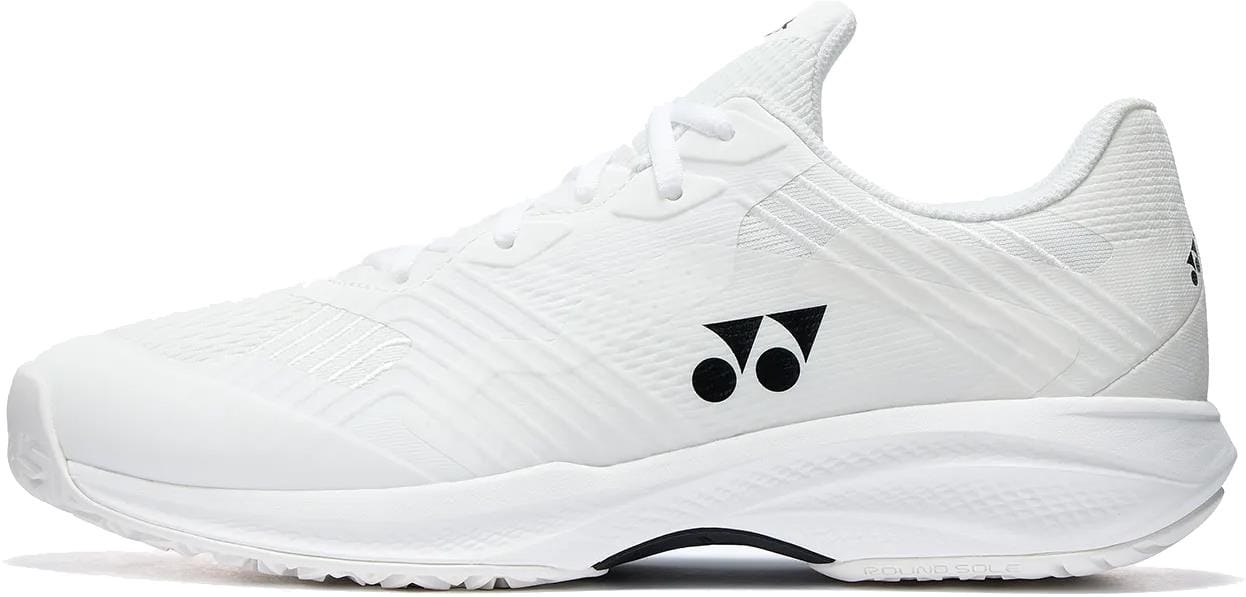 The Yonex Power Cushion Sonicage Wide Unisex Tennis Shoes in white feature a textured sole and upper, black logo accents, white laces, a low-cut design, and durable comfort for top court performance.