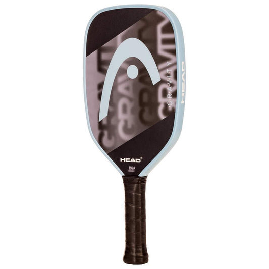 The HEAD Gravity Team EX 2025 Pickleball Paddle in Black/Blue features a black face, light blue edge, large HEAD logo, black grip handle, and "GRAVITY" text. Designed for control and spin potential. Brand: HEAD.