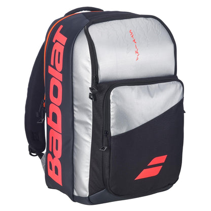 The Babolat Pure Strike Tennis Backpack - Carbon Grey by Babolat features a large front pocket and a stylish black and silver design—perfect for players who want a functional, fashionable tennis bag.