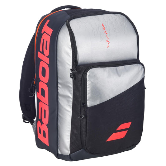 The Babolat Pure Strike Tennis Backpack - Carbon Grey by Babolat features a large front pocket and a stylish black and silver design—perfect for players who want a functional, fashionable tennis bag.