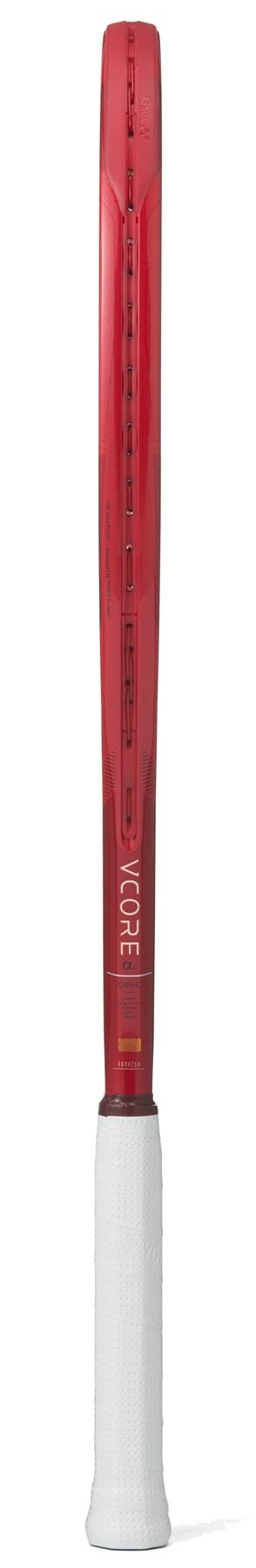 The Yonex VCORE Alpha L Ruby Red 2026 Tennis Racket is shown from the side, sporting a white grip and "VCORE" branding near the throat, with ISOMETRIC technology that boosts performance.