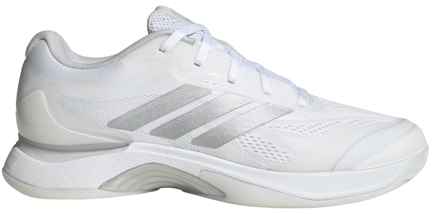 The adidas Avacourt 3 Womens Tennis Shoes in white feature silver stripes, breathable mesh panels, and a textured rubber sole—perfect for tennis. Shown from the side on a plain background.