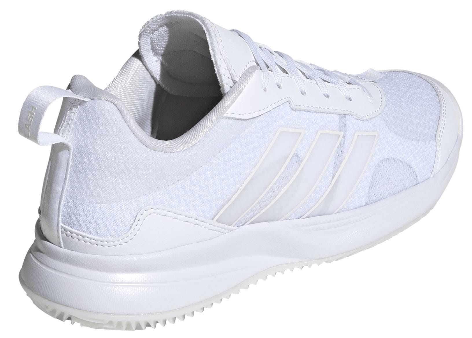 The adidas ADIDAS AvaFlash Women’s Tennis Shoes - White feature mesh and synthetic materials, three signature white stripes, a lace-up design, and a textured sole for lightweight comfort on the tennis court.
