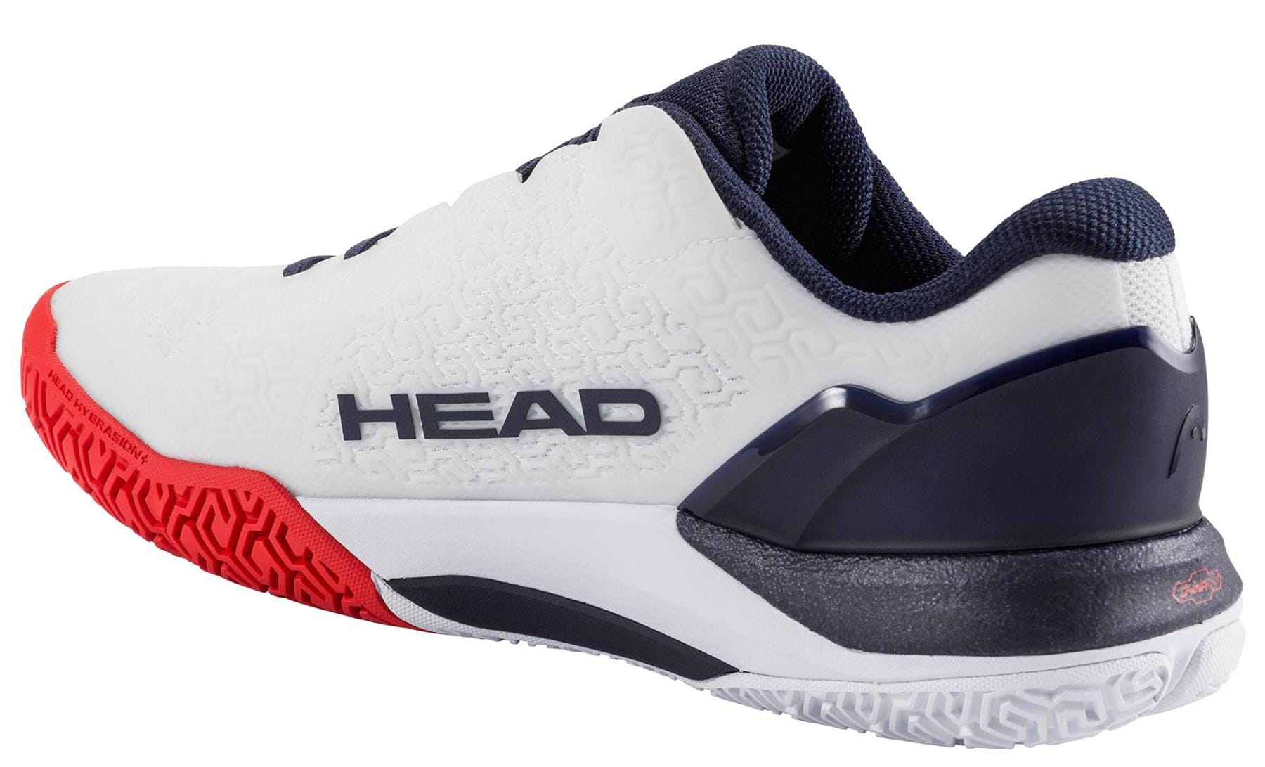 The HEAD Revolt Pro 5.0 Men's Tennis Shoes in white/navy feature a textured surface and red-white patterned sole, shown from the side and slightly behind—perfect for baseline players seeking style and performance.